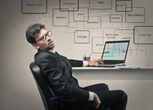 Man stressed out at his laptop